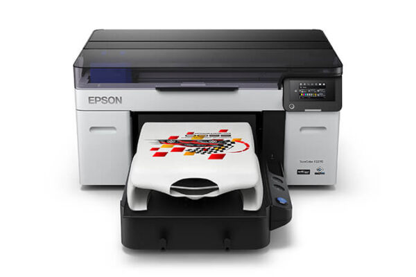 Epson SureColor F2270 DTG printer in operation, printing a colorful design on a white t-shirt, with its ink system and control panel visible on the right.
