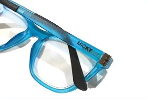Bright blue glasses with the name “MICKY” printed on the outer edge of the temple.