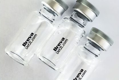 Three contact lens bottles with the words “Breva” and “iJet2L.com” printed on them in black lettering in front of a white background.