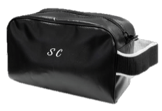 Black leather bag with the initials “SC” printed on it in white.