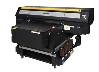 Mimaki UJF-7151 Plus II UV inkjet printer with black body and yellow stripe across the top.